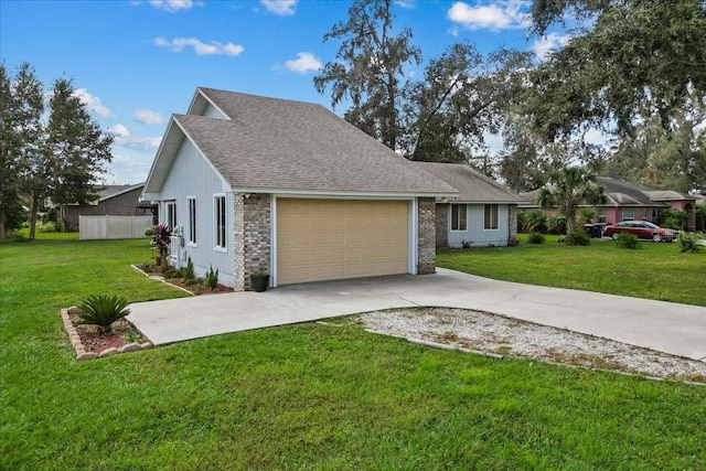 view of front of home featuring a garage and a front lawn