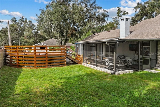 view of yard featuring a sunroom