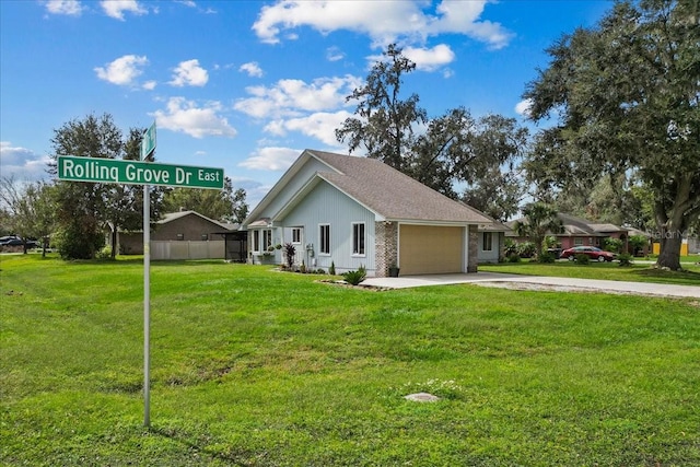 view of home's exterior featuring a garage and a yard