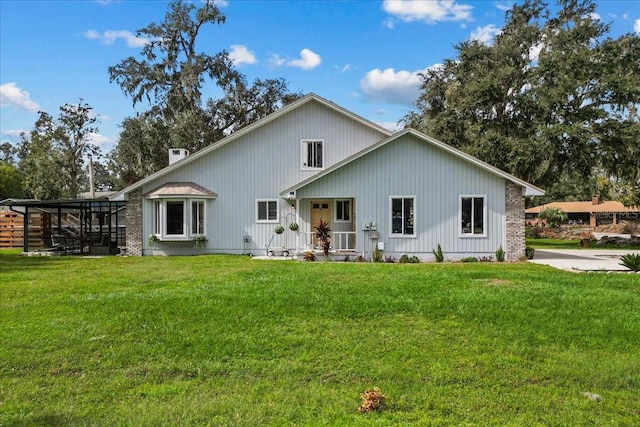 rear view of house with a yard