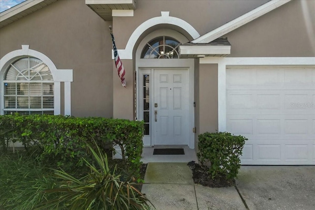 property entrance featuring a garage