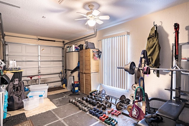 exercise room with a textured ceiling and ceiling fan