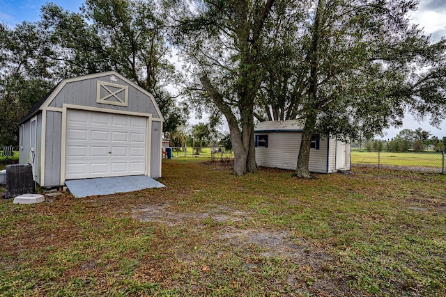 garage with a lawn