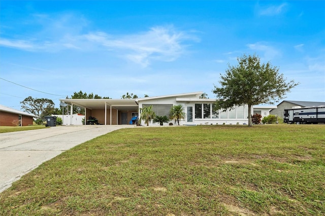 ranch-style house with a front lawn and a carport