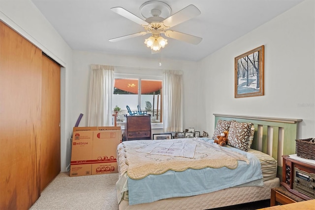 bedroom with light colored carpet and ceiling fan