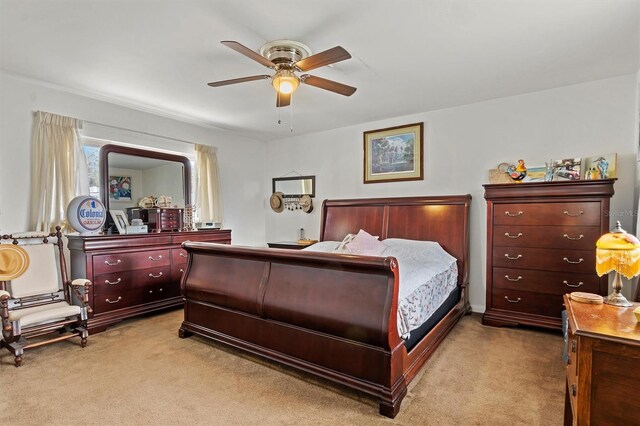 bedroom featuring light carpet and ceiling fan