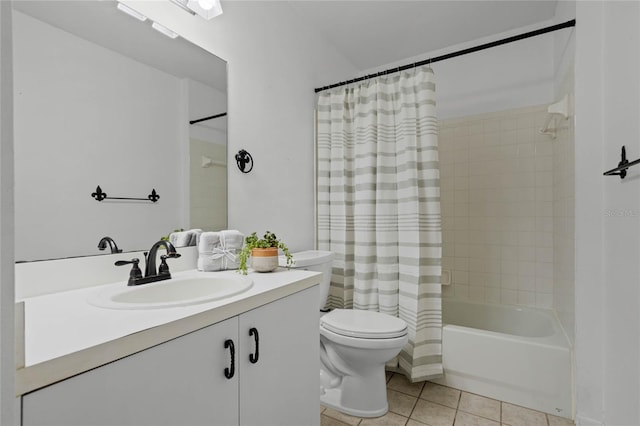 full bathroom featuring tile patterned flooring, vanity, toilet, and shower / tub combo