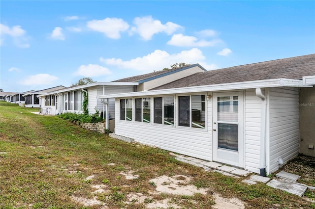 view of property exterior featuring a yard