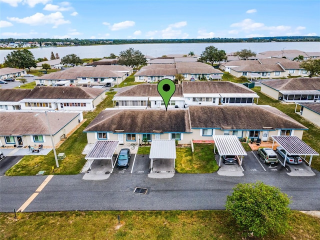 birds eye view of property featuring a water view