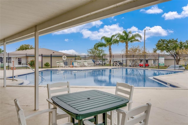 view of swimming pool featuring a patio area