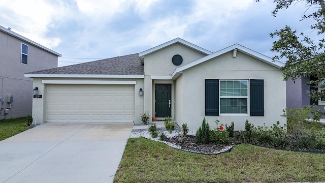 ranch-style house featuring a garage and a front lawn