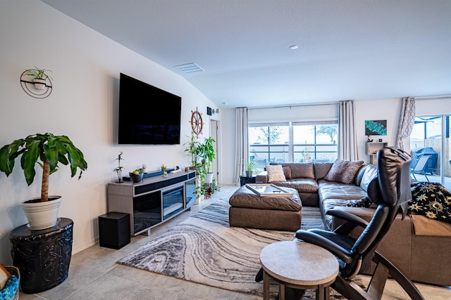 tiled living room with vaulted ceiling