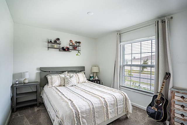 bedroom featuring dark colored carpet