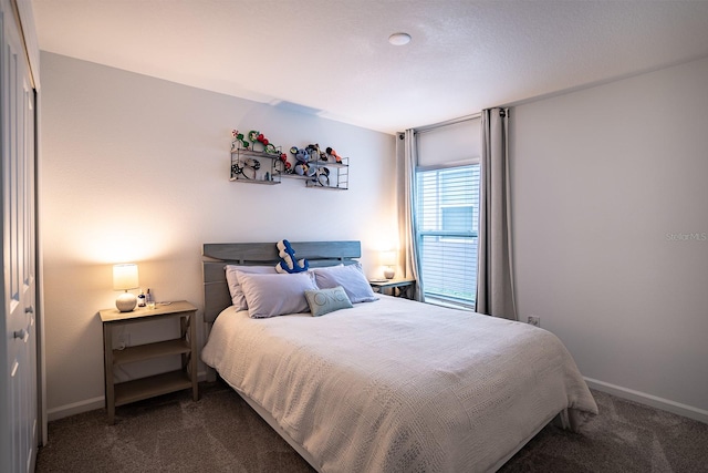 carpeted bedroom featuring a closet