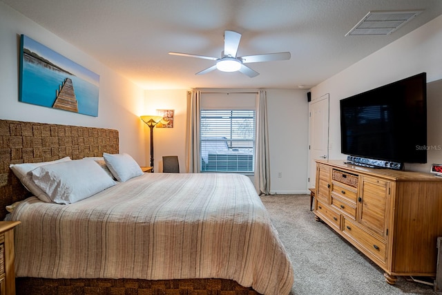 bedroom with light carpet and ceiling fan