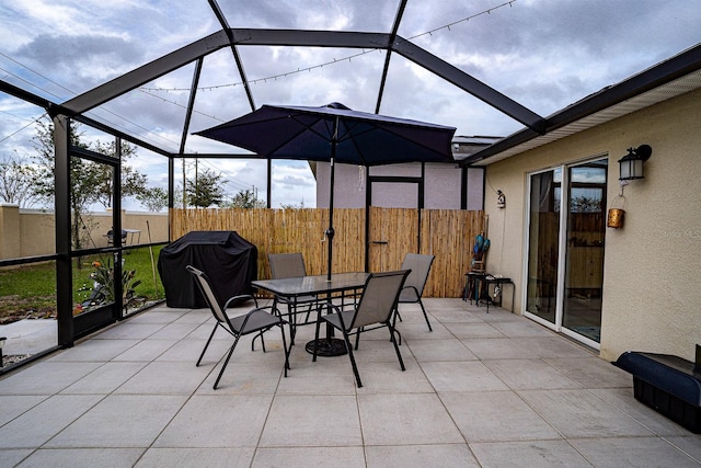 exterior space with a lanai and a grill