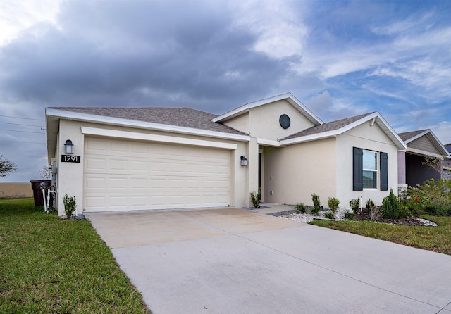 single story home featuring a garage and a front lawn