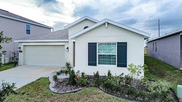 view of front of property featuring a garage and a front yard