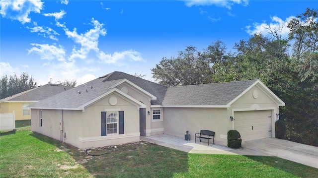 ranch-style house with a garage and a front yard