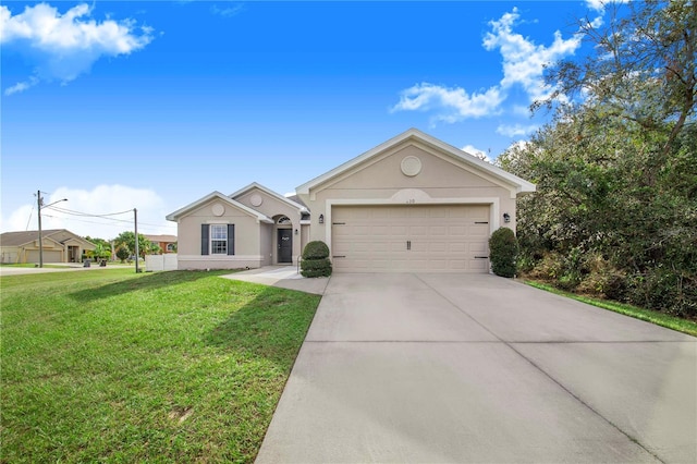 ranch-style home with a garage and a front yard