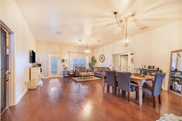 dining room featuring an inviting chandelier and hardwood / wood-style flooring