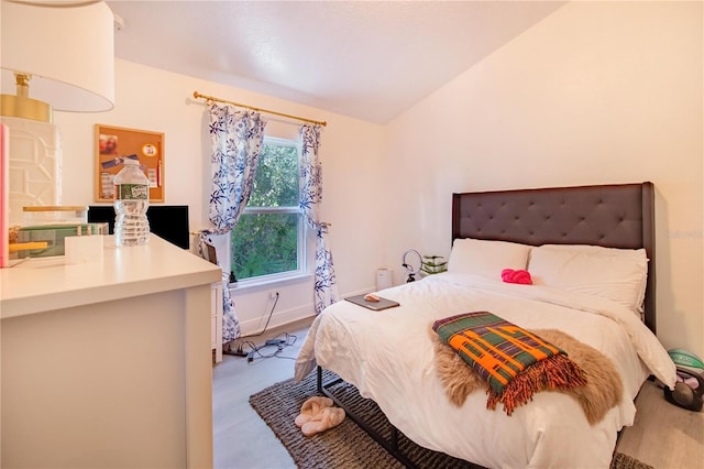 bedroom with vaulted ceiling