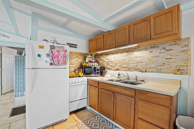 kitchen with wooden ceiling, white appliances, sink, vaulted ceiling with beams, and tasteful backsplash