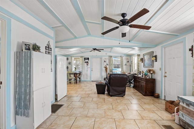 tiled living room with lofted ceiling with beams and ceiling fan