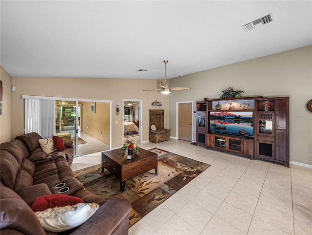 living room with ceiling fan and light tile patterned flooring