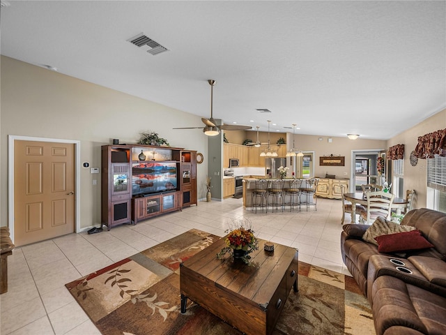 living room with light tile patterned floors and ceiling fan