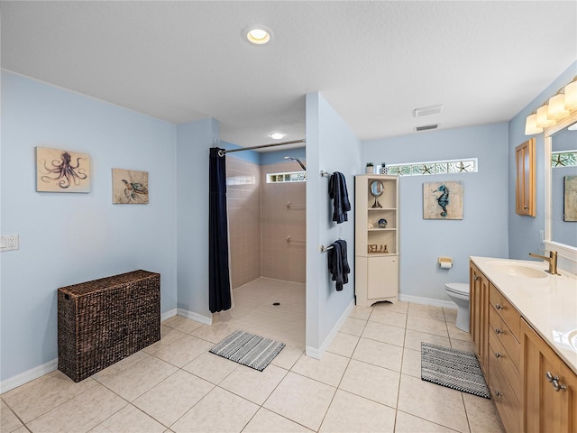 bathroom with vanity, toilet, tile patterned floors, and a shower with curtain