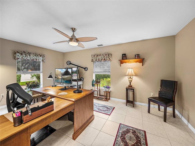 tiled office space featuring ceiling fan