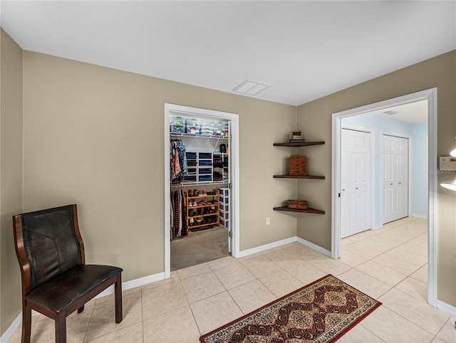 living area featuring light tile patterned flooring