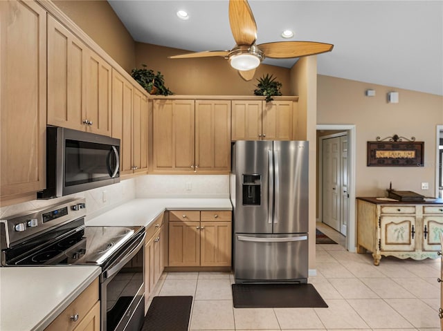 kitchen featuring light brown cabinetry, light tile patterned floors, and appliances with stainless steel finishes