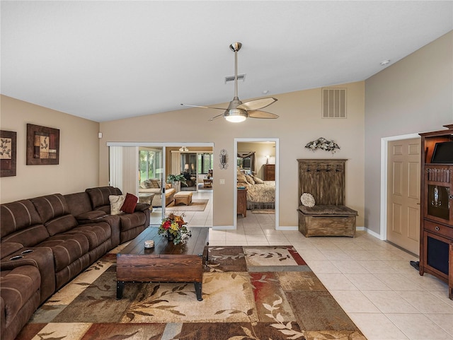 living room featuring vaulted ceiling, ceiling fan, and light tile patterned flooring