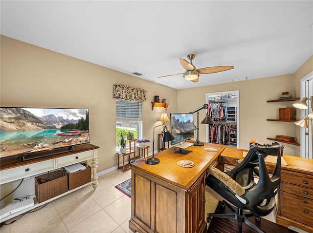 office featuring ceiling fan and light tile patterned flooring