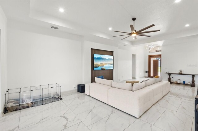 193 Stargrass Dr, Auburndale, FL 33823 - living area with a raised ceiling, recessed lighting, a ceiling fan, and marble finish floors