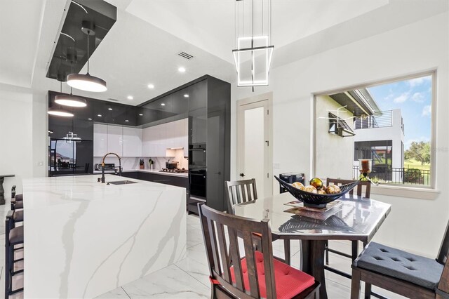 193 Stargrass Dr, Auburndale, FL 33823 - dining area featuring light marble finish floors and recessed lighting