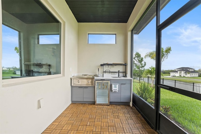 193 Stargrass Dr, Auburndale, FL 33823 - unfurnished sunroom with a water view, beverage cooler, and a sink