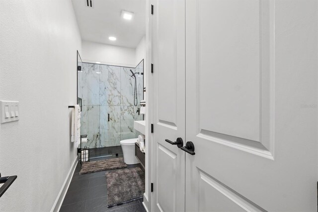 193 Stargrass Dr, Auburndale, FL 33823 - full bathroom featuring a marble finish shower, tile patterned flooring, recessed lighting, baseboards, and toilet