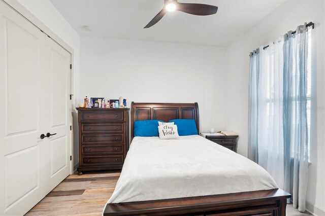 193 Stargrass Dr, Auburndale, FL 33823 - bedroom with light wood finished floors and ceiling fan