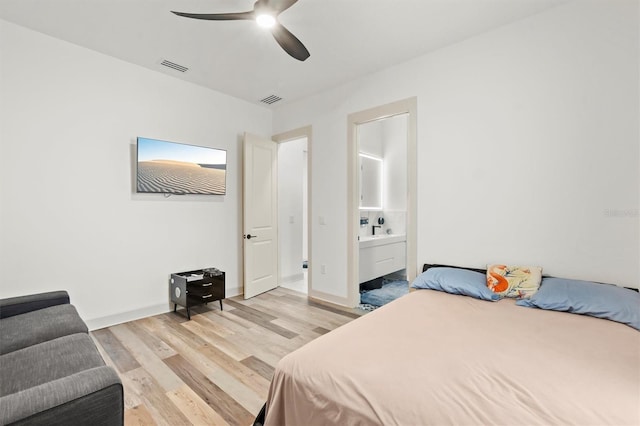 193 Stargrass Dr, Auburndale, FL 33823 - bedroom featuring light wood-style flooring, ceiling fan, and connected bathroom