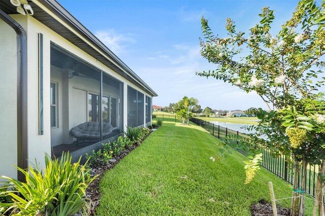 193 Stargrass Dr, Auburndale, FL 33823 - view of yard with a sunroom and a water view