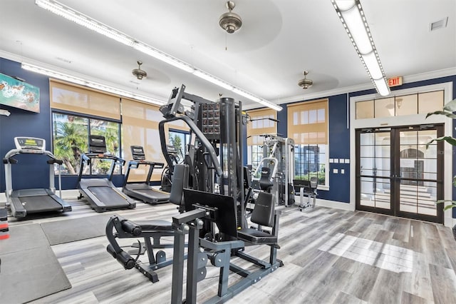 193 Stargrass Dr, Auburndale, FL 33823 - exercise room with french doors, crown molding, ceiling fan, baseboards, and wood finished floors