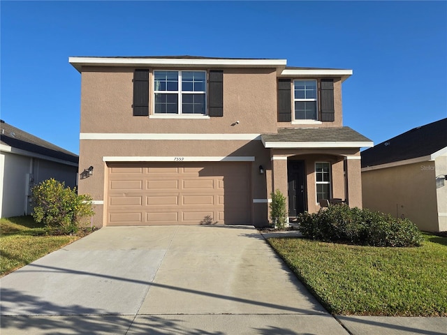 view of front of house with a garage and a front lawn