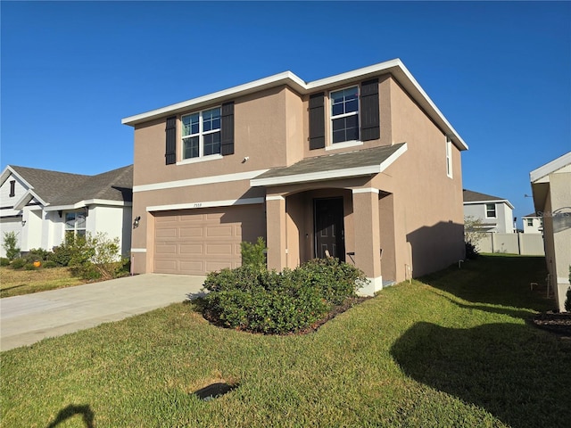 view of front facade with a garage and a front yard