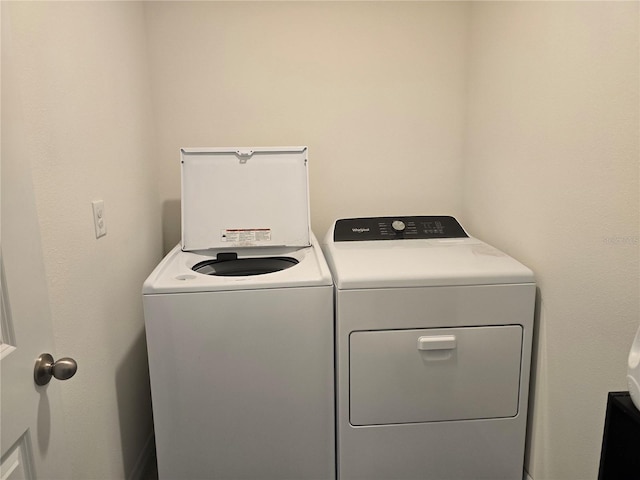 washroom featuring washer and dryer