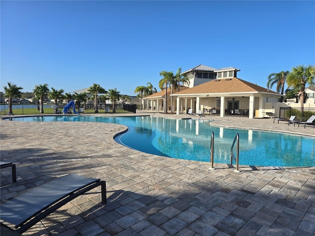 view of swimming pool with a patio