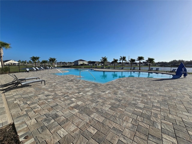 view of swimming pool featuring a patio area