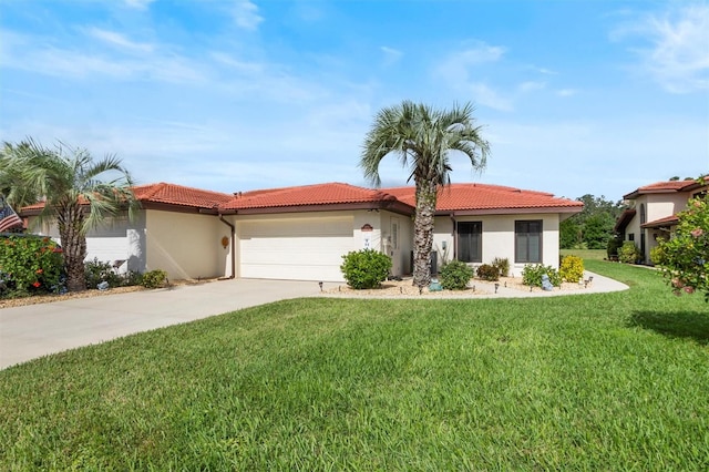 mediterranean / spanish home with a front yard and a garage